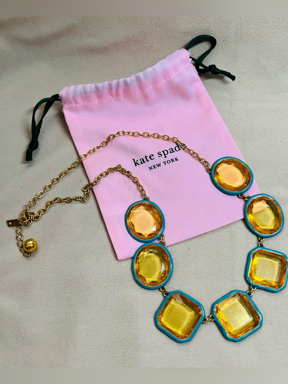 kate spade Gold Toned Necklace with Yellow Resin Stones Set in Teal Enamel.